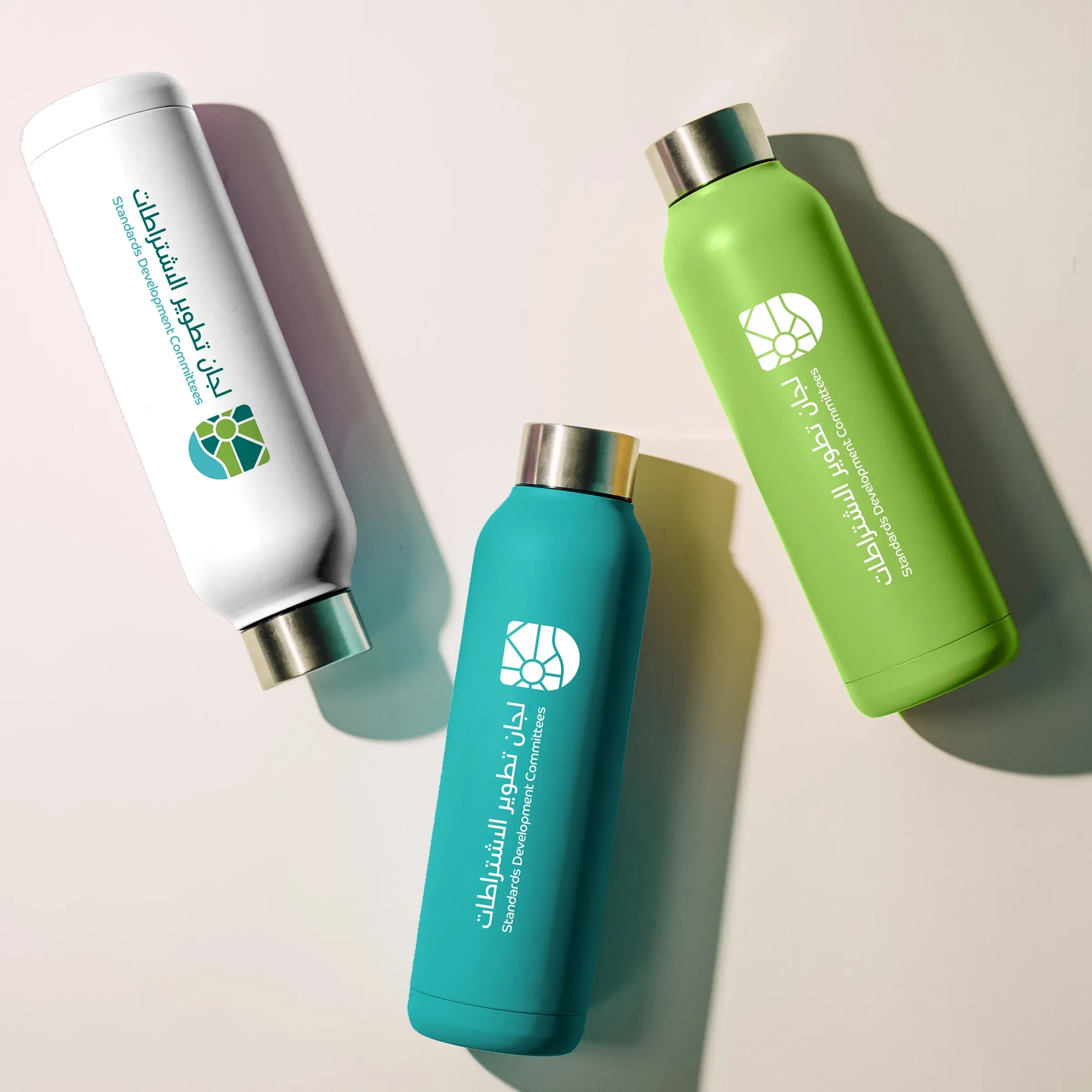 Standards Development Committees branded water bottles in white, blue, and green. Skyne, a branding agency, ensured consistent branding across all merchandise.