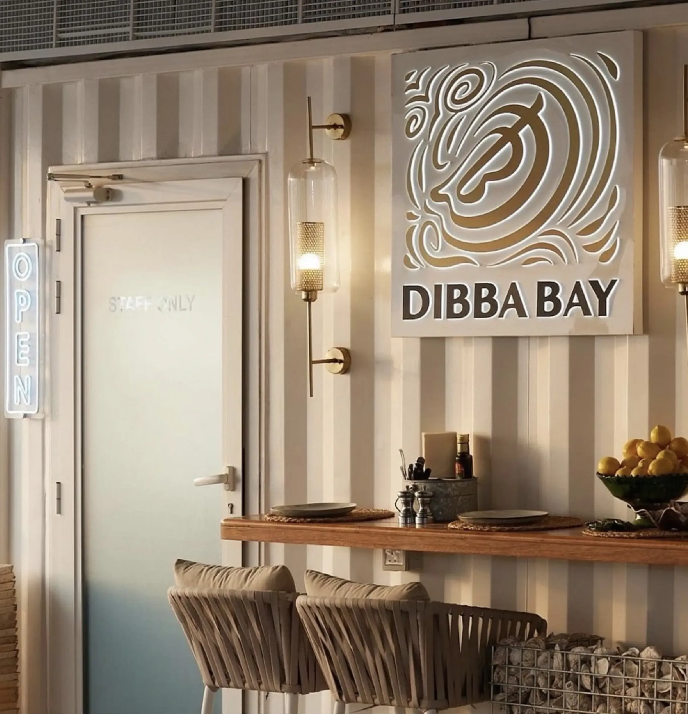 Dibba Bay office interior with large logo on the wall, reflecting brand presence. Skyne, a branding agency, ensured brand consistency across all touchpoints