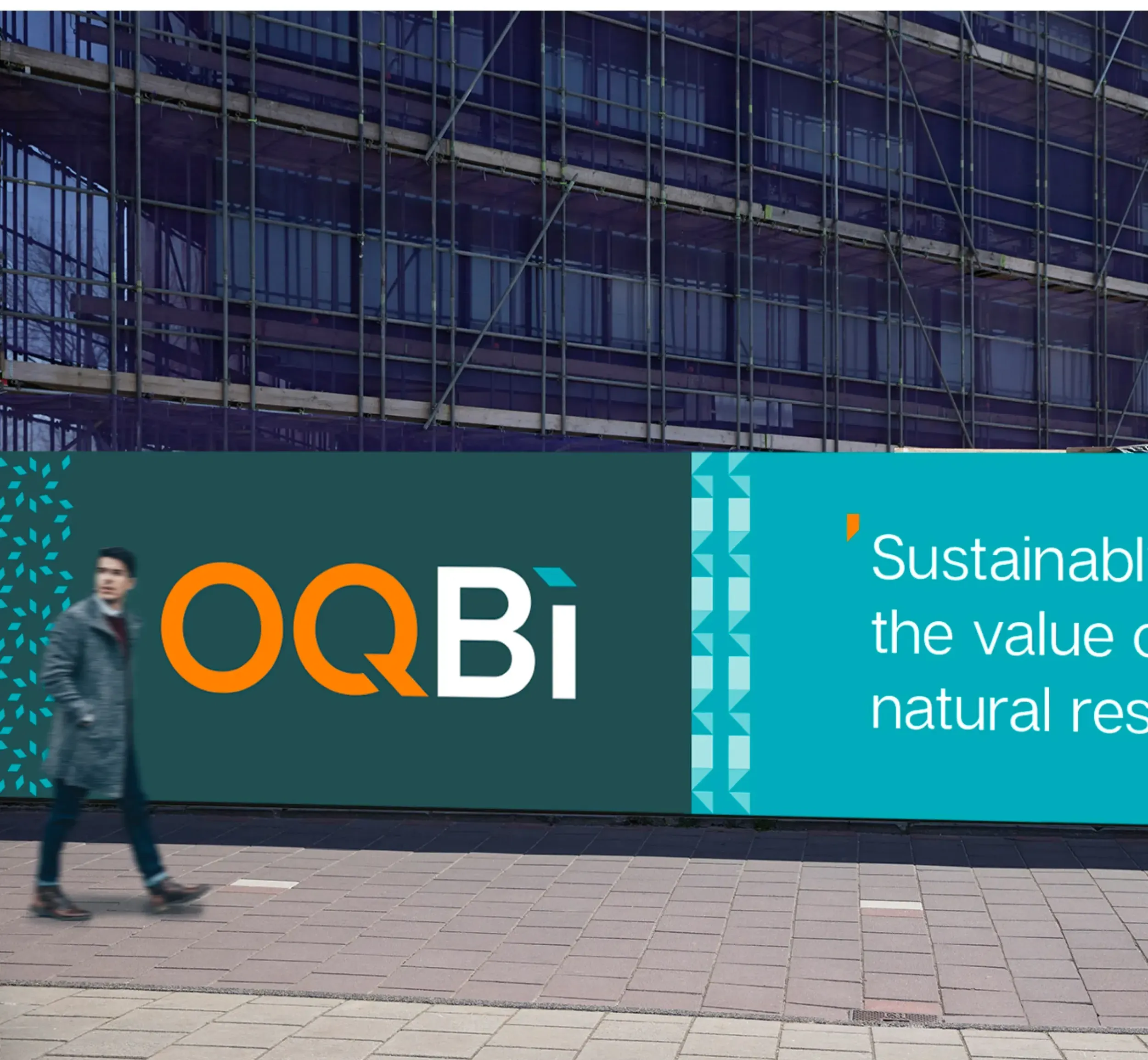 Large outdoor billboard for OQBi with logo and text about sustainability. Skyne, a branding agency, creates impactful outdoor advertising campaigns and visual communication for energy sector clients in Dubai, Riyadh, and Jeddah.