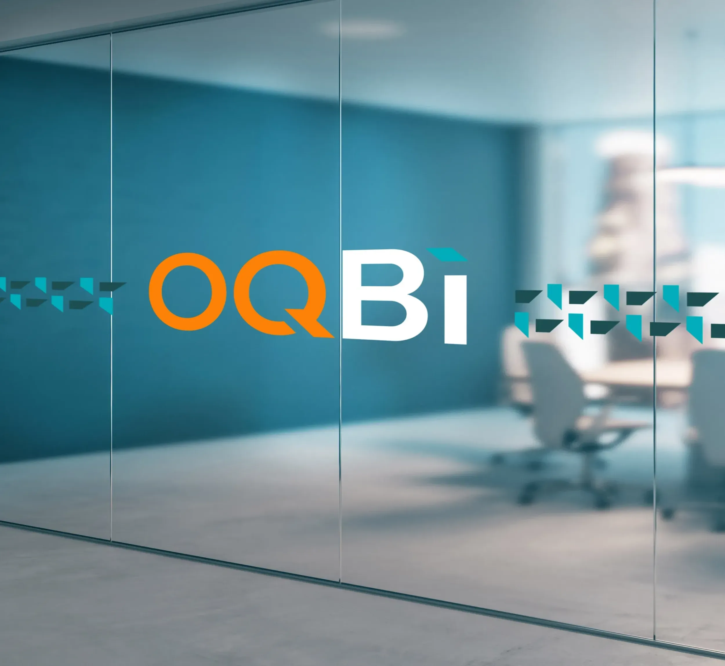 OQBi logo and geometric pattern as frosted decals on glass office partition. Skyne, a branding agency, provides comprehensive branding solutions and interior design integration for businesses in Dubai, Riyadh, and Jeddah.