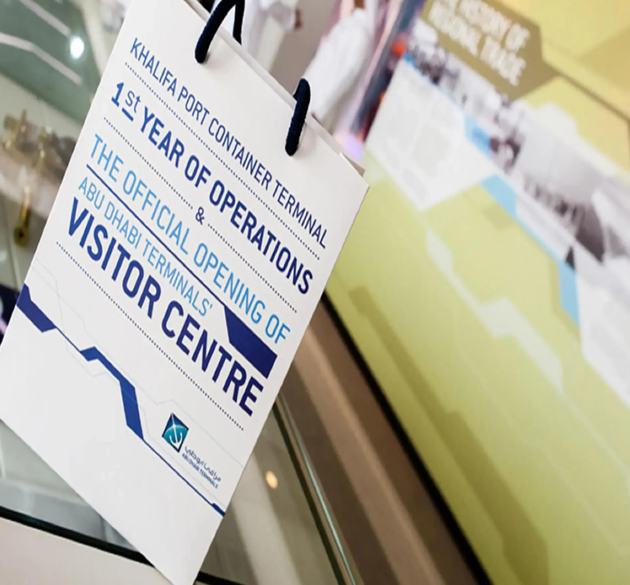 Commemorative paper bag for Khalifa Port Container Terminal Visitor Centre opening. Skyne specializes in event branding design for corporate clients in Dubai, Riyadh, and Jeddah.