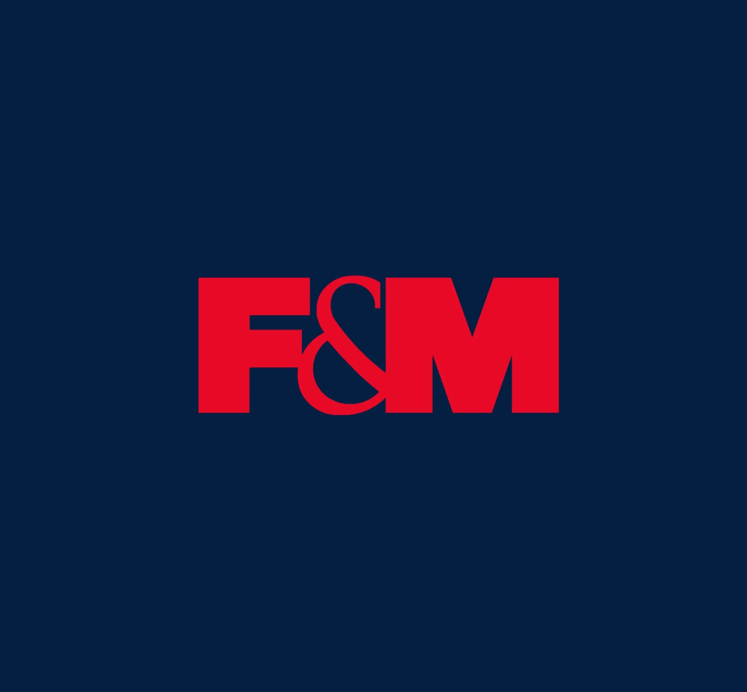 F&M International logo in red on a dark blue background. Skyne, a branding agency, designed this impactful logo.