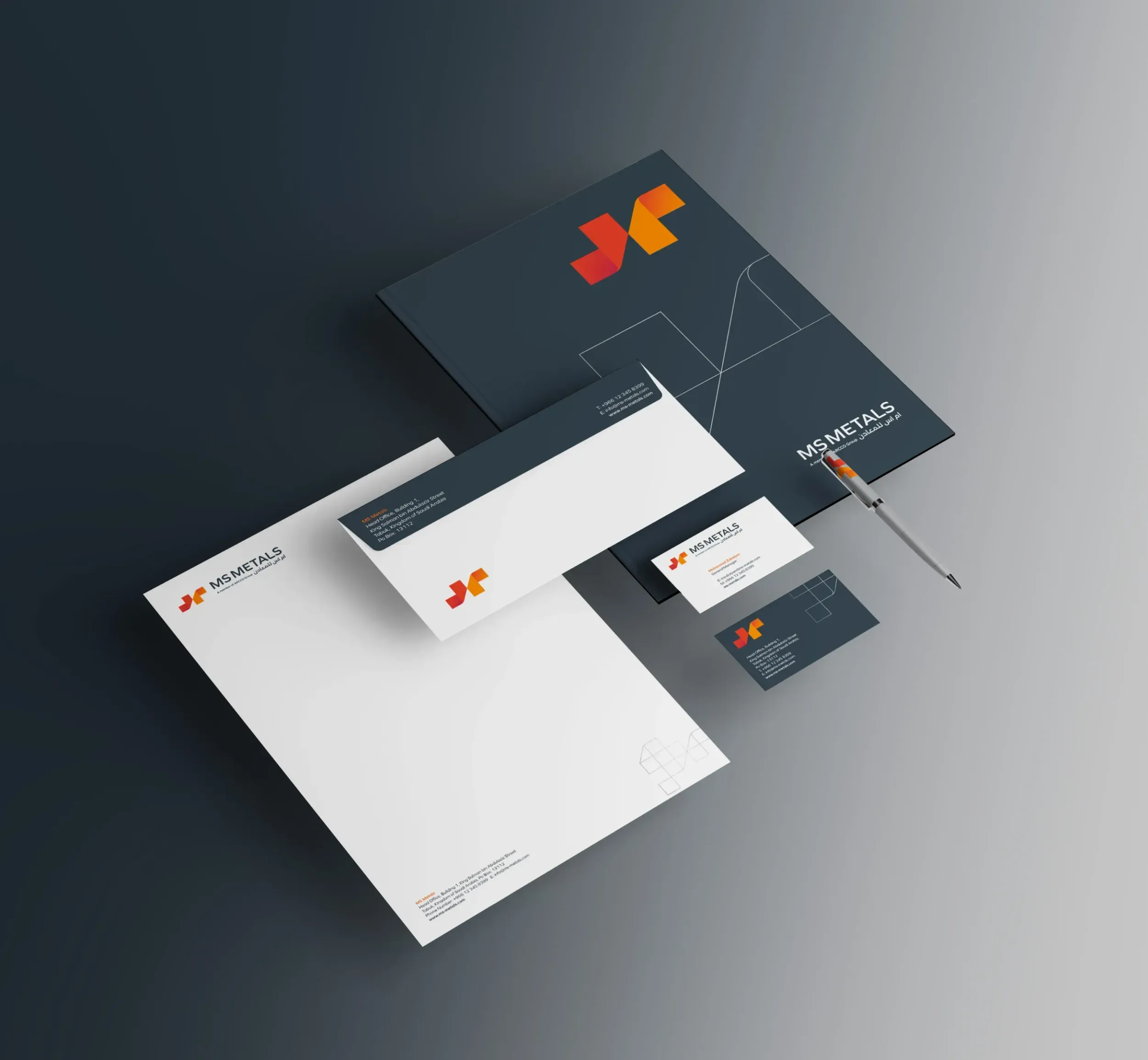 Flat lay of MS Metals branding materials including folder, letterhead, envelopes, and business cards, showcasing comprehensive corporate identity by Skyne, a branding agency in Dubai, Riyadh, and Jeddah.
