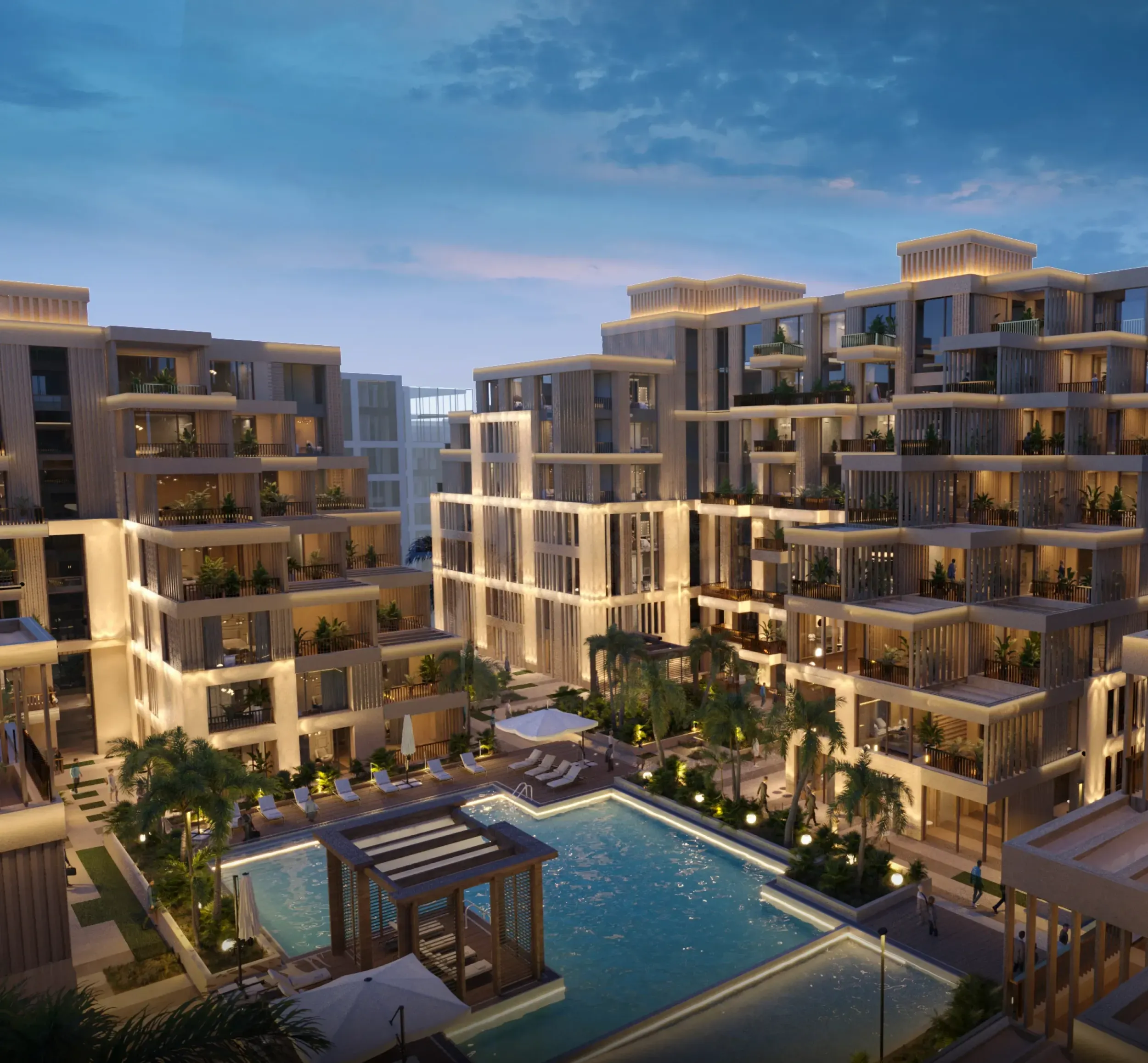 Aerial view of Arisha Terraces residential complex at dusk with illuminated buildings and swimming pool, highlighting luxury real estate branding. Skyne excels in branding and marketing for property developments