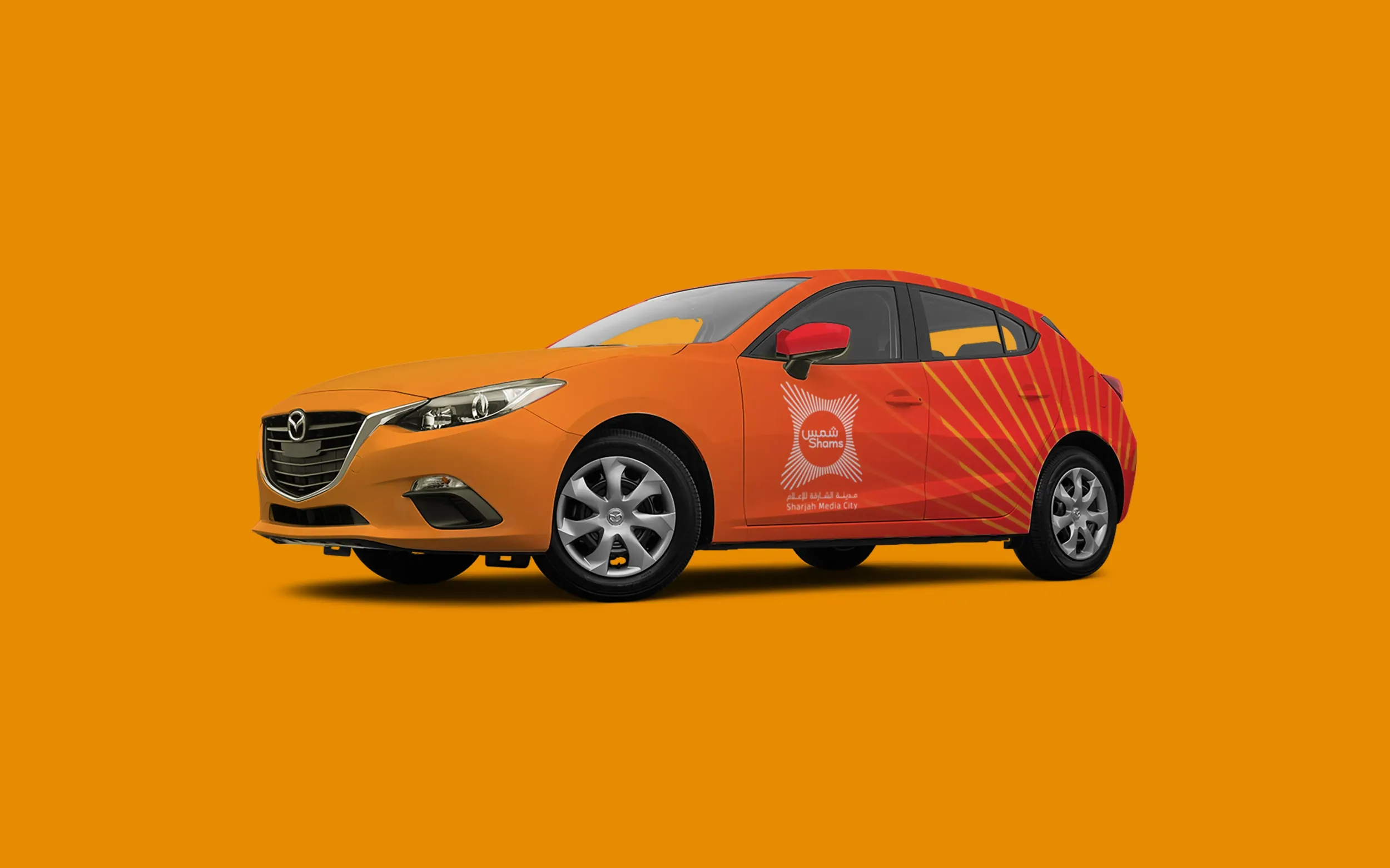 Car with Shams Media City branding, showcasing vehicle wrap design. Skyne, a creative agency, extended the brand identity to various touchpoints. 
