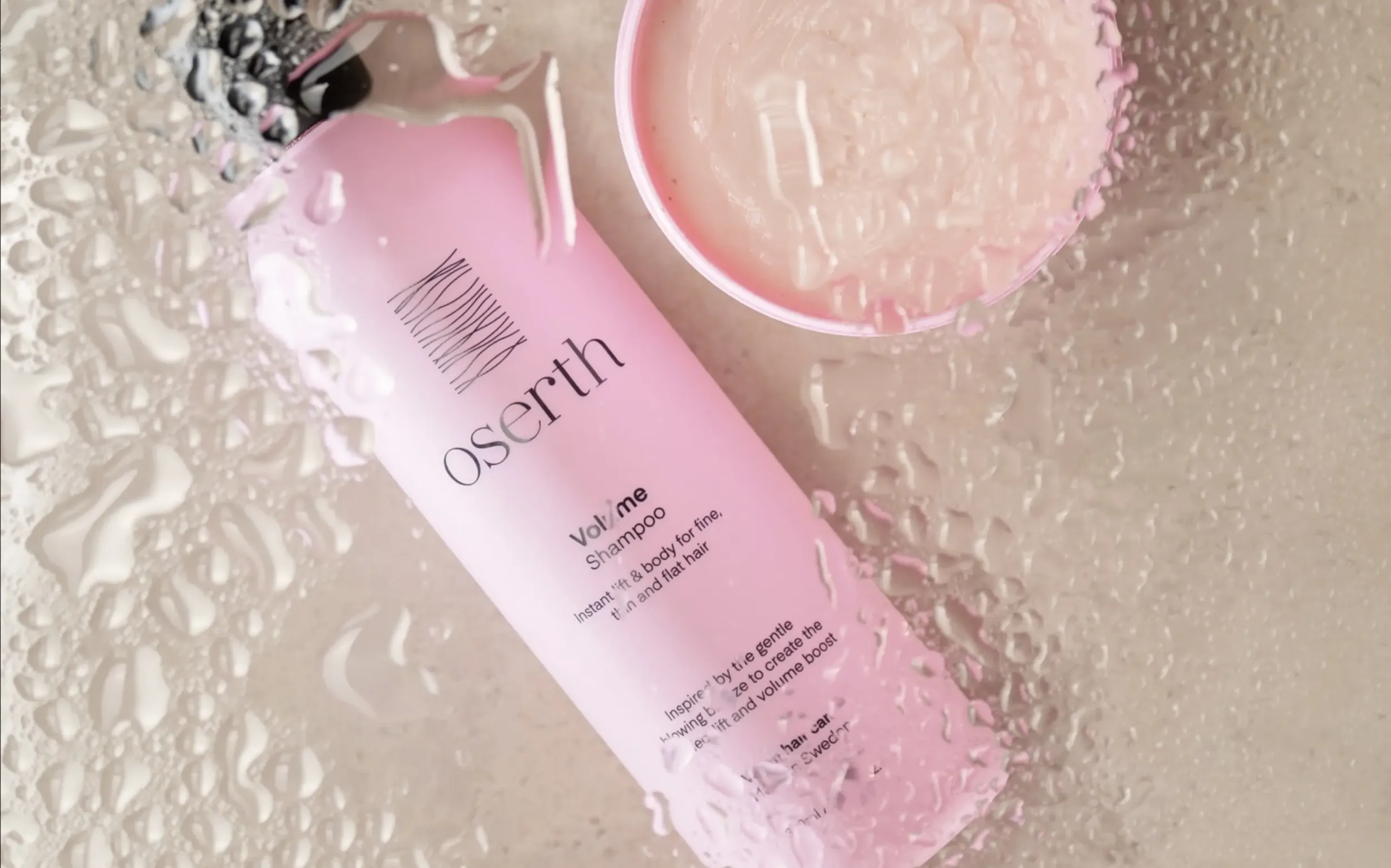 Oserth Volume Shampoo and hair masque with water droplets, emphasizing product’s hydrating properties and effective packaging design and branding by Skyne, a creative agency.