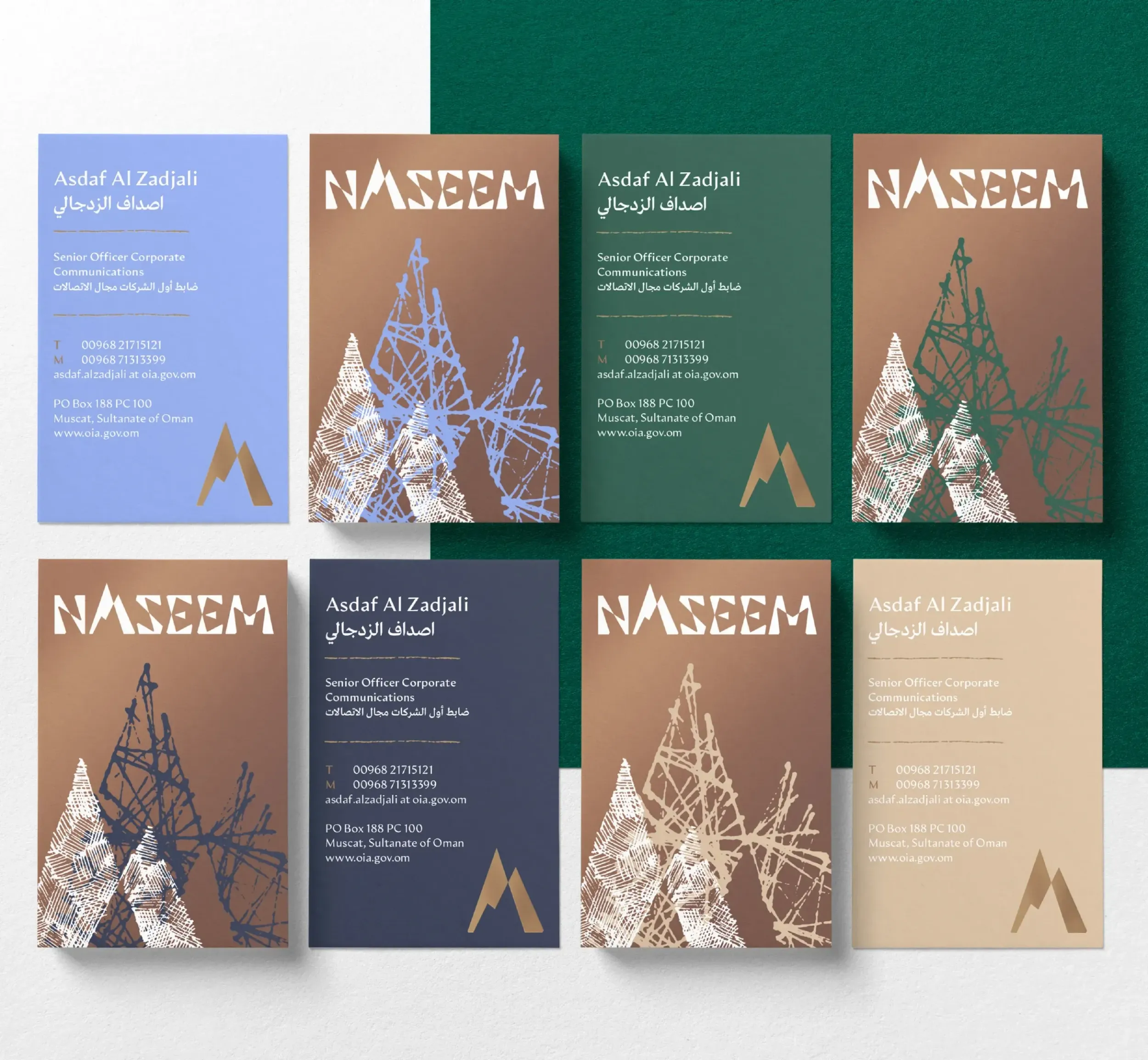 Collection of Naseem business cards in various colors with logo and mountain graphics. This highlights the cohesive visual identity by Skyne, a branding and creative agency-