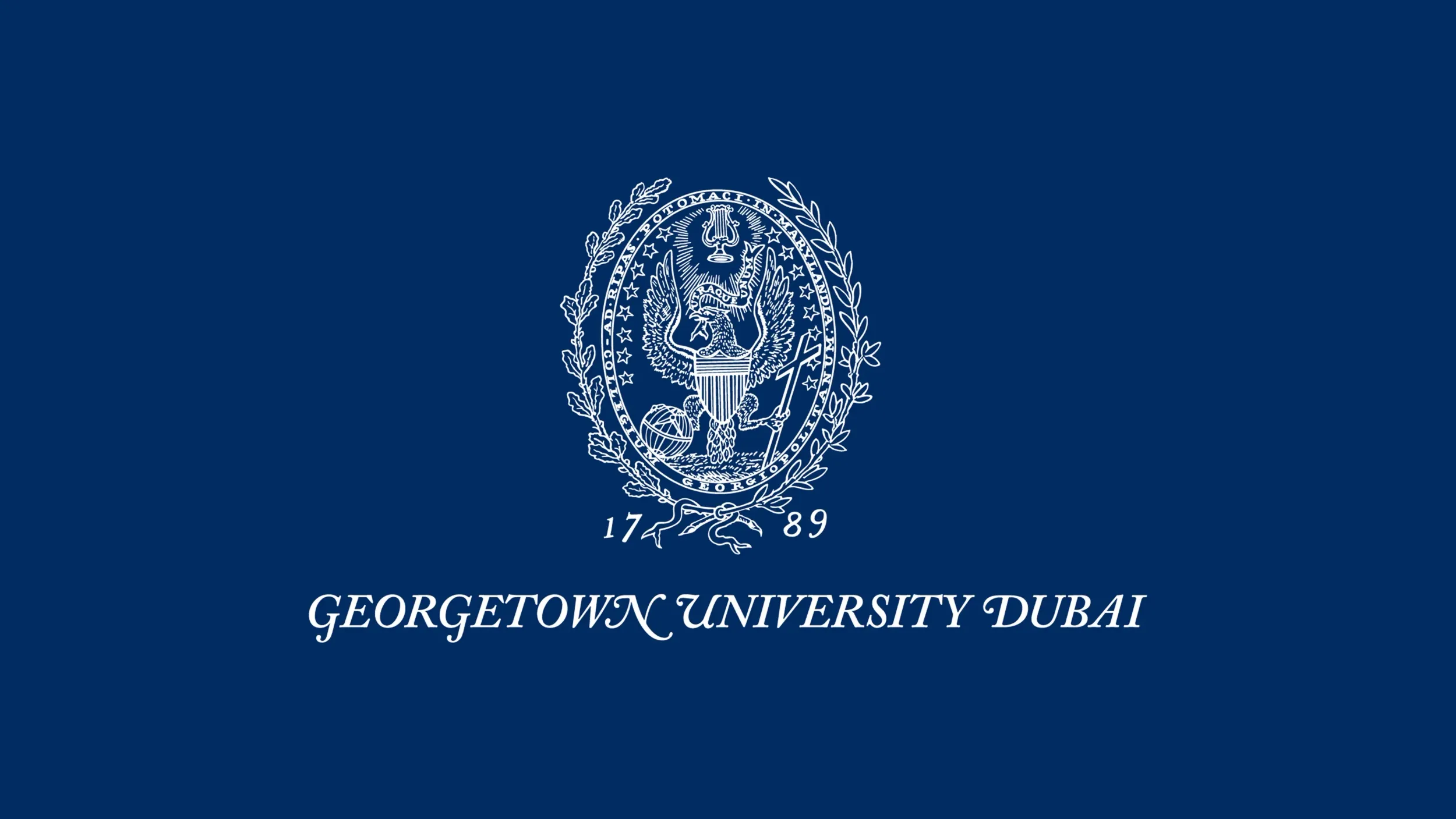 Georgetown University Dubai logo in white on a blue background, representing the localized brand identity for the university in the UAE. Skyne specializes in educational branding and localization strategies for clients in Dubai, Riyadh, and Jeddah.