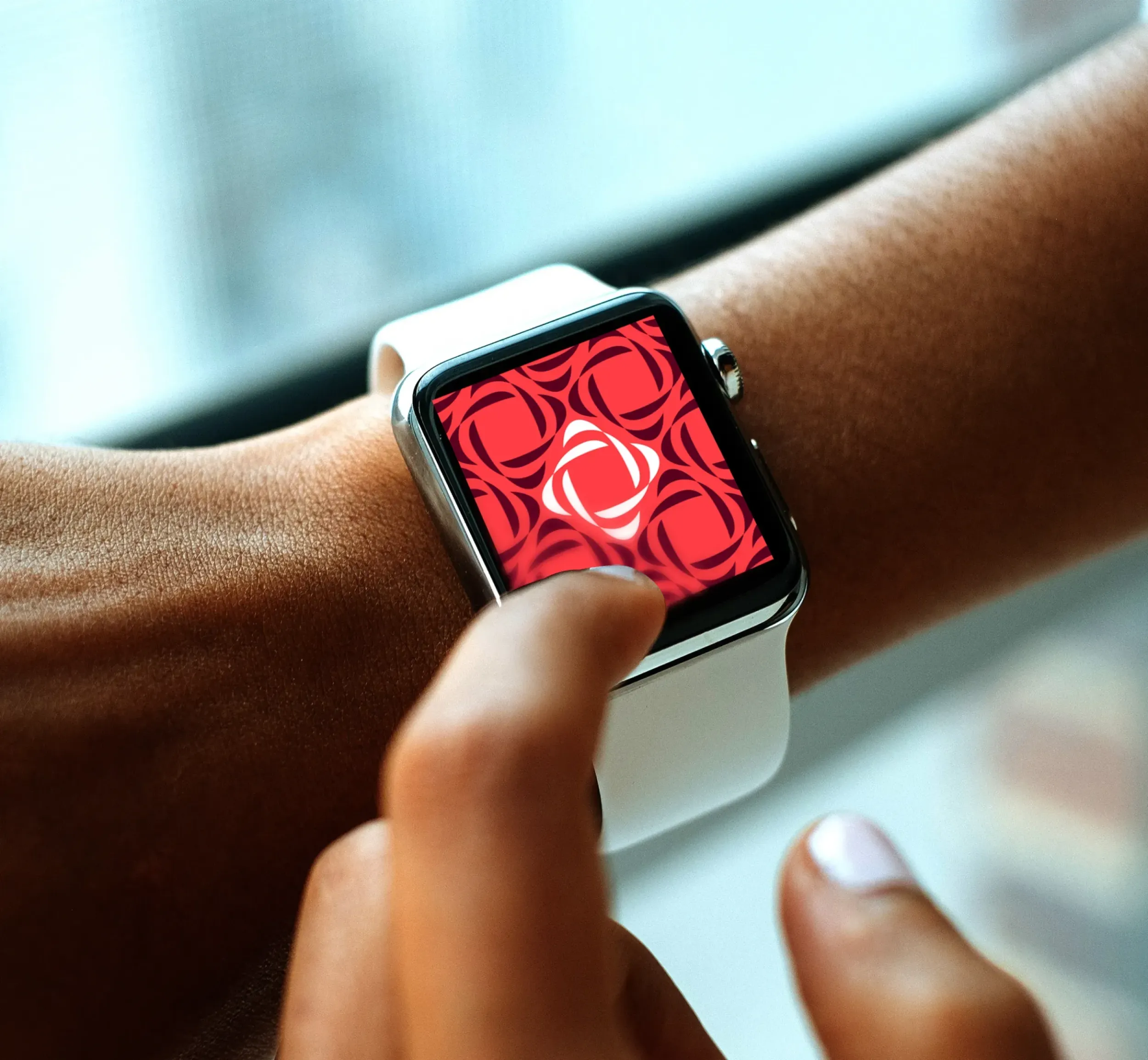 Smartwatch displaying Yaqeen Capital branding, showcasing digital integration by Skyne. 