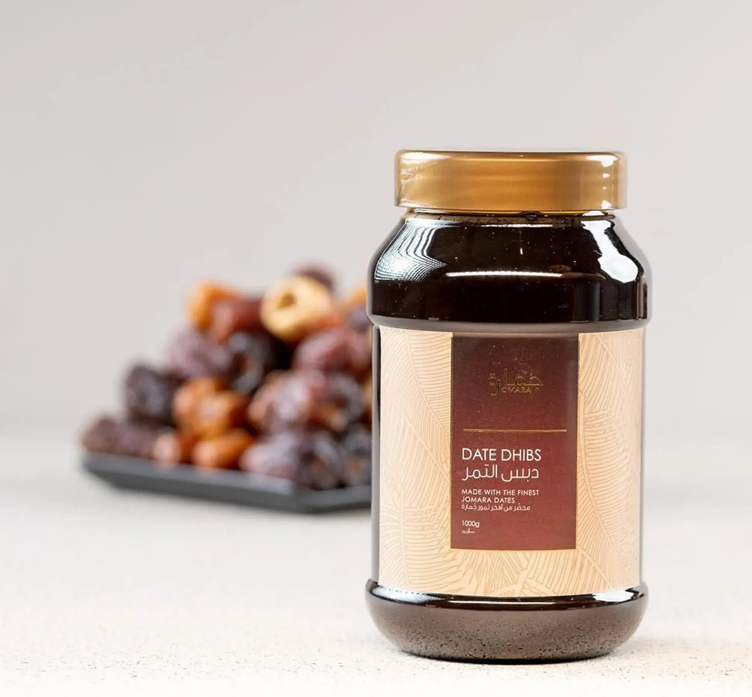 Jomara Date Dhibs jar, highlighting sophisticated packaging design by Skyne, a branding agency specializing in FMCG branding in Dubai, Riyadh, and Jeddah.