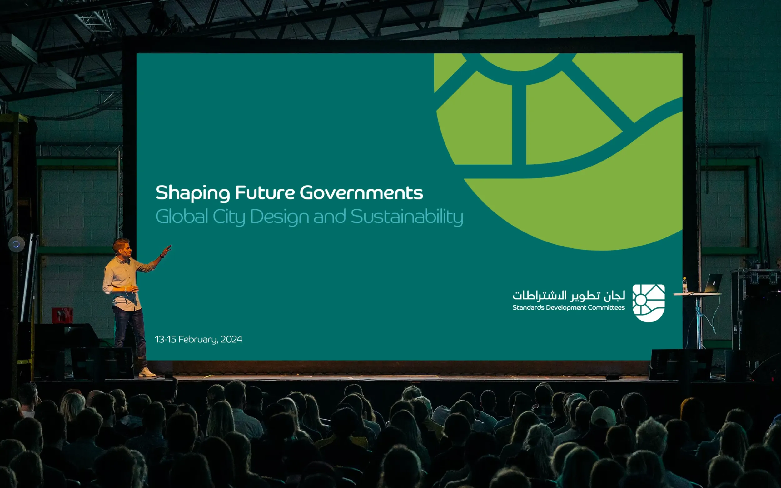 A speaker presenting on "Shaping Future Governments" at a conference, with the Standards Development Committees logo. Skyne, a branding agency, helped position the Ministry as a forward-thinking authority. 