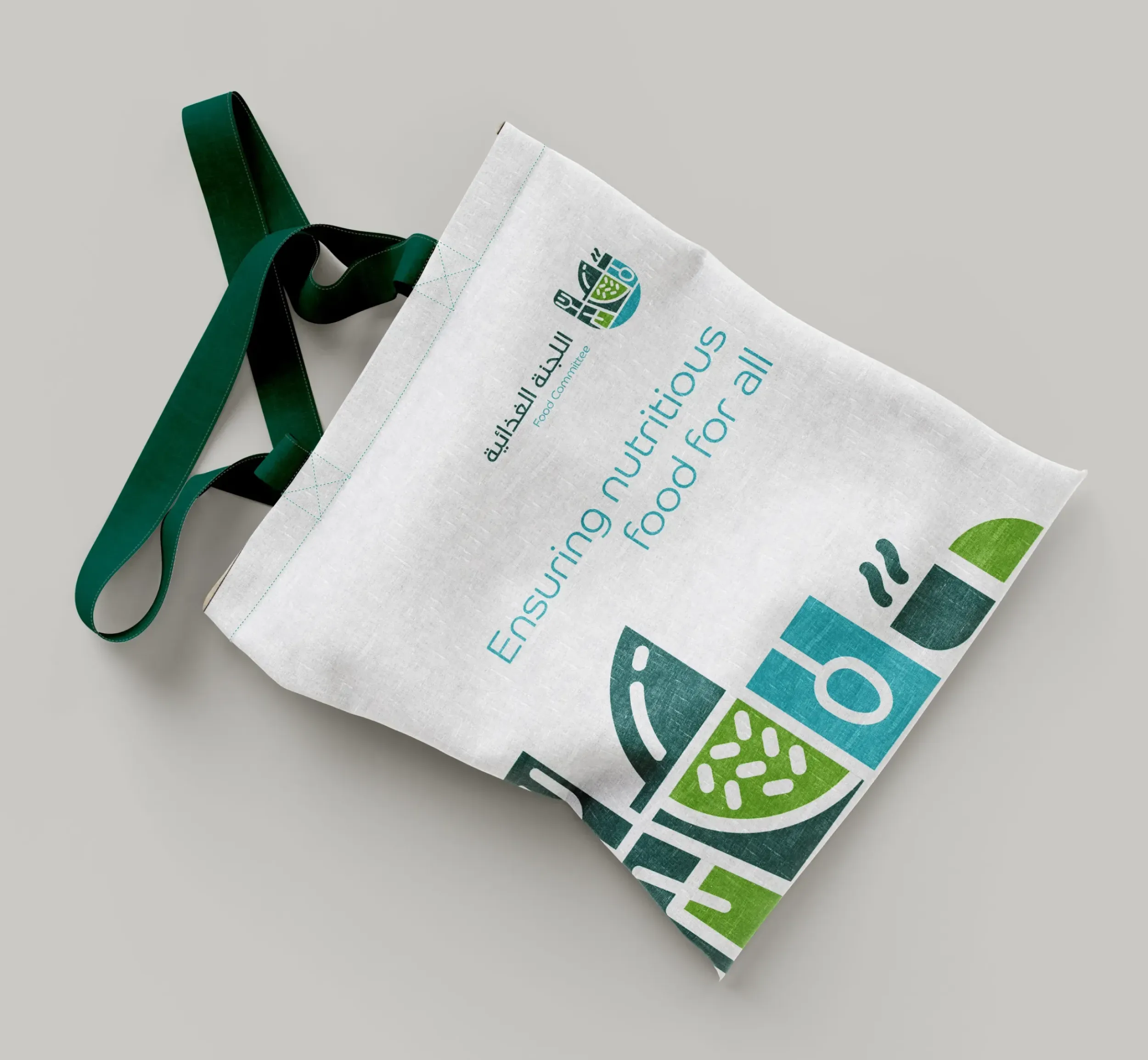 Reusable shopping bag with the Food Committee logo and slogan, "Ensuring nutritious food for all." Skyne, a branding agency, designed impactful collateral.