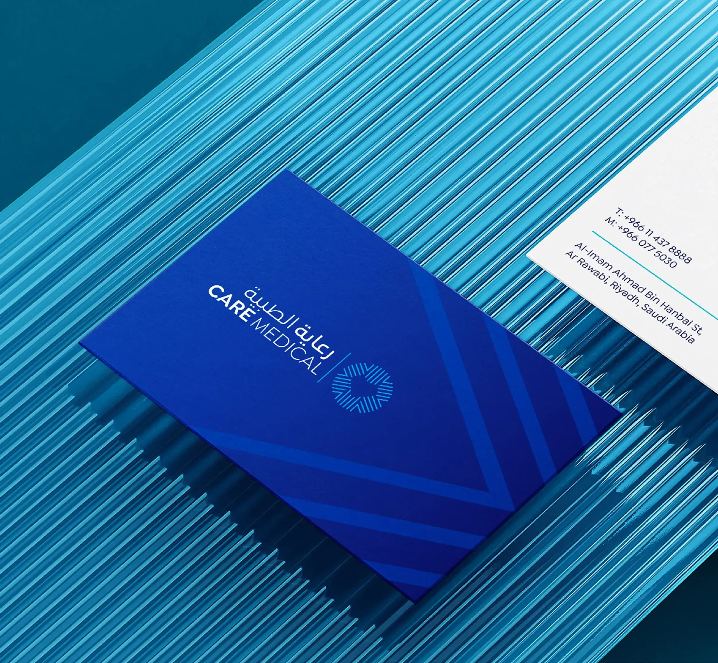 Care Medical branded business cards and a brochure, illustrating Skyne's meticulous attention to detail in packaging design and corporate branding for a leading healthcare provider.