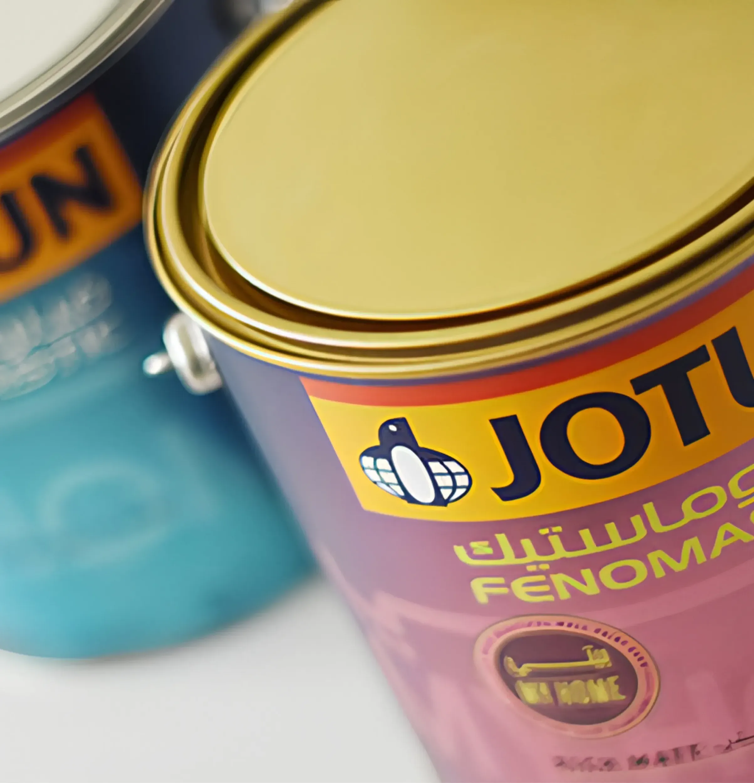 Close-up of Jotun Fenomastic paint cans, highlighting the successful branding and packaging design efforts of Skyne, a branding agency.