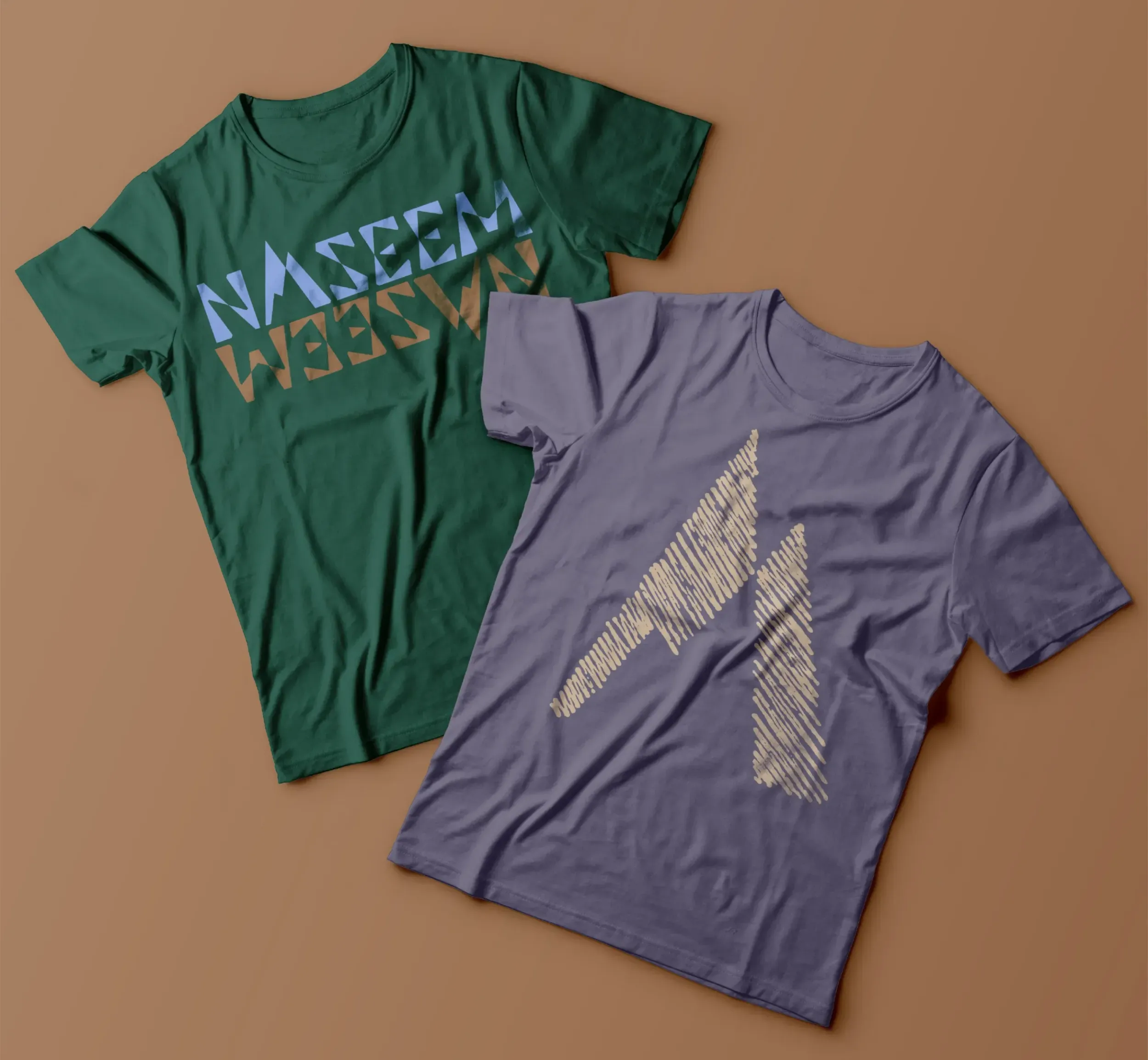 Two t-shirts with Naseem branding and mountain graphics. This shows brand identity application on merchandise, a key aspect of packaging design and branding agency services by Skyne. 