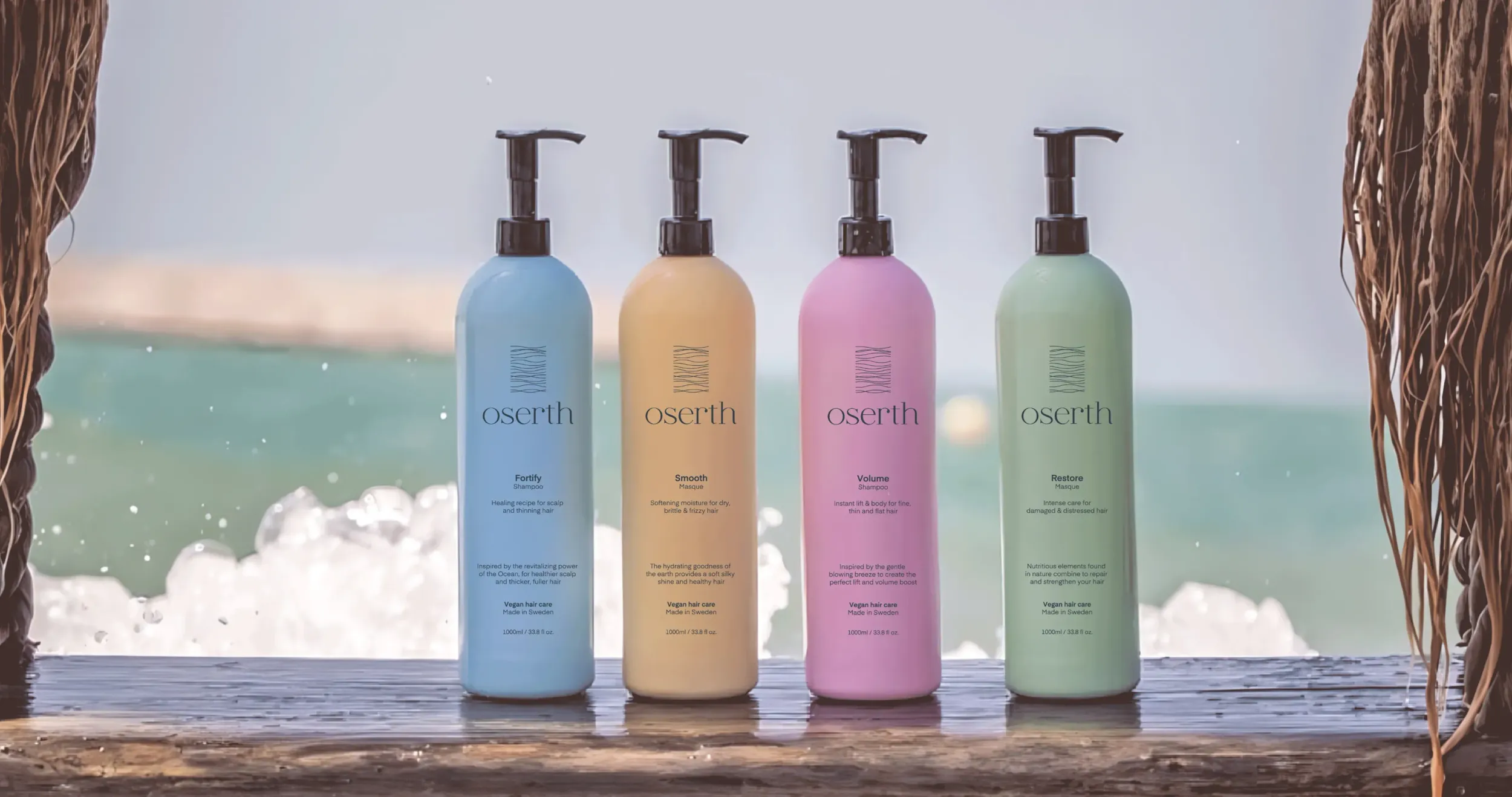 Four Oserth haircare bottles in pastel colors against an ocean background, showcasing product line and brand’s connection to nature, and effective packaging design by Skyne, a creative agency.