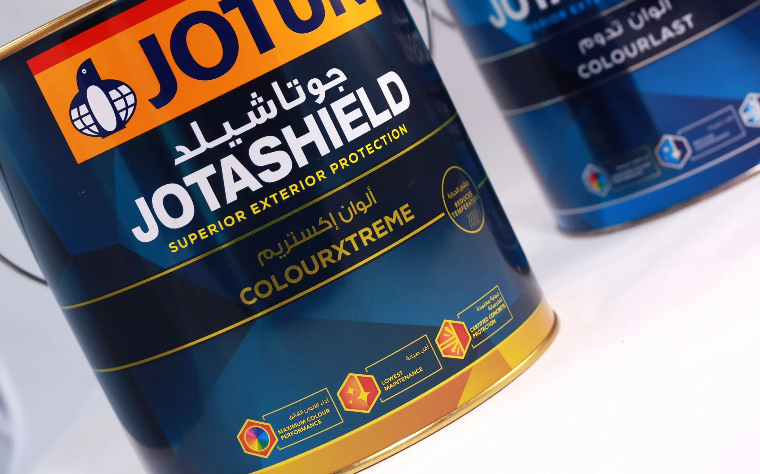 Close-up of Jotun Jotashield ColourXtreme paint can with bilingual Arabic-English labeling, highlighting superior exterior protection