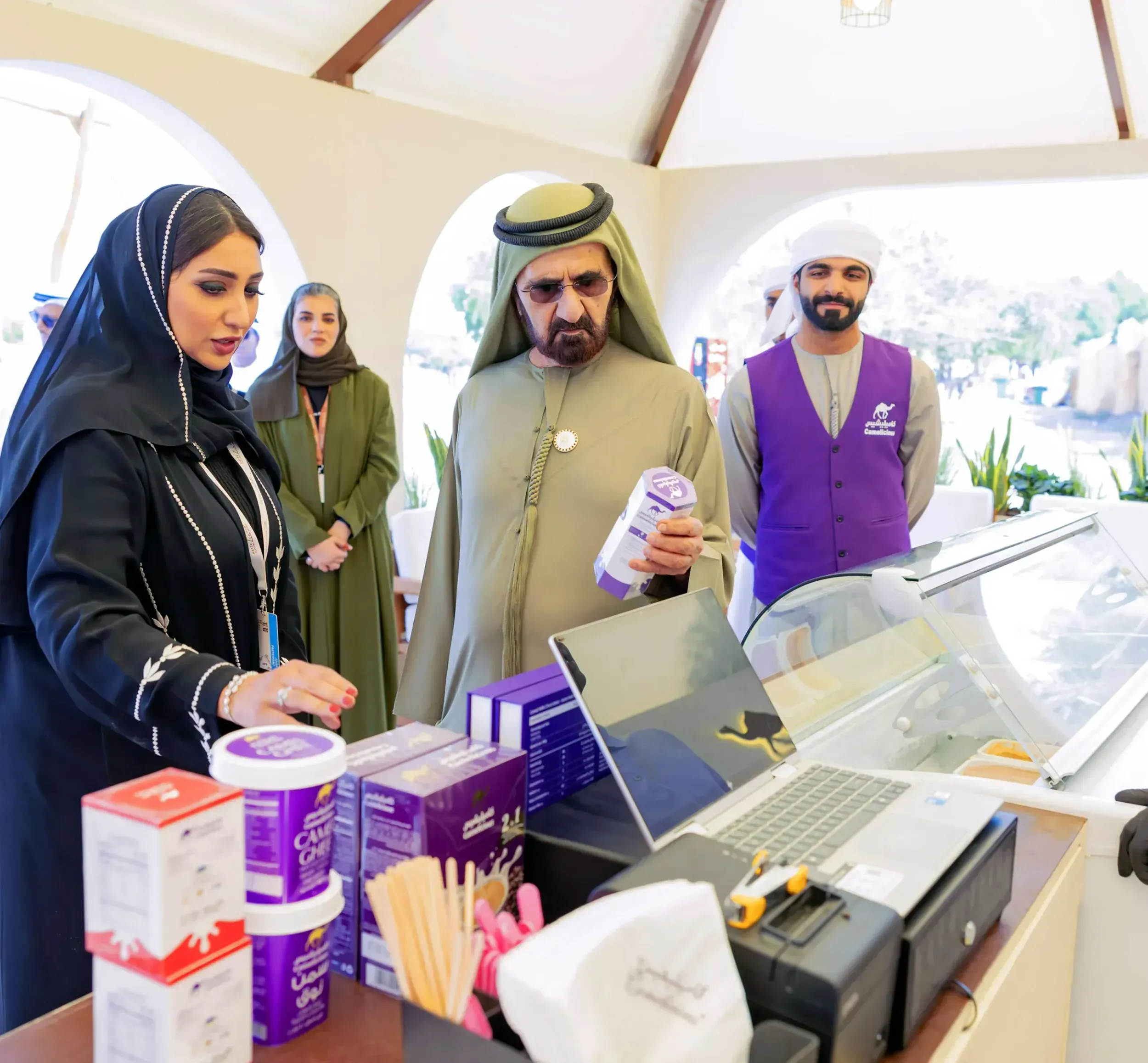 Sheikh Mohammed bin Rashid Al Maktoum examining Camelicious camel milk products, highlighting the brand's premium positioning and Skyne's successful branding strategy for this superfood in the global market.