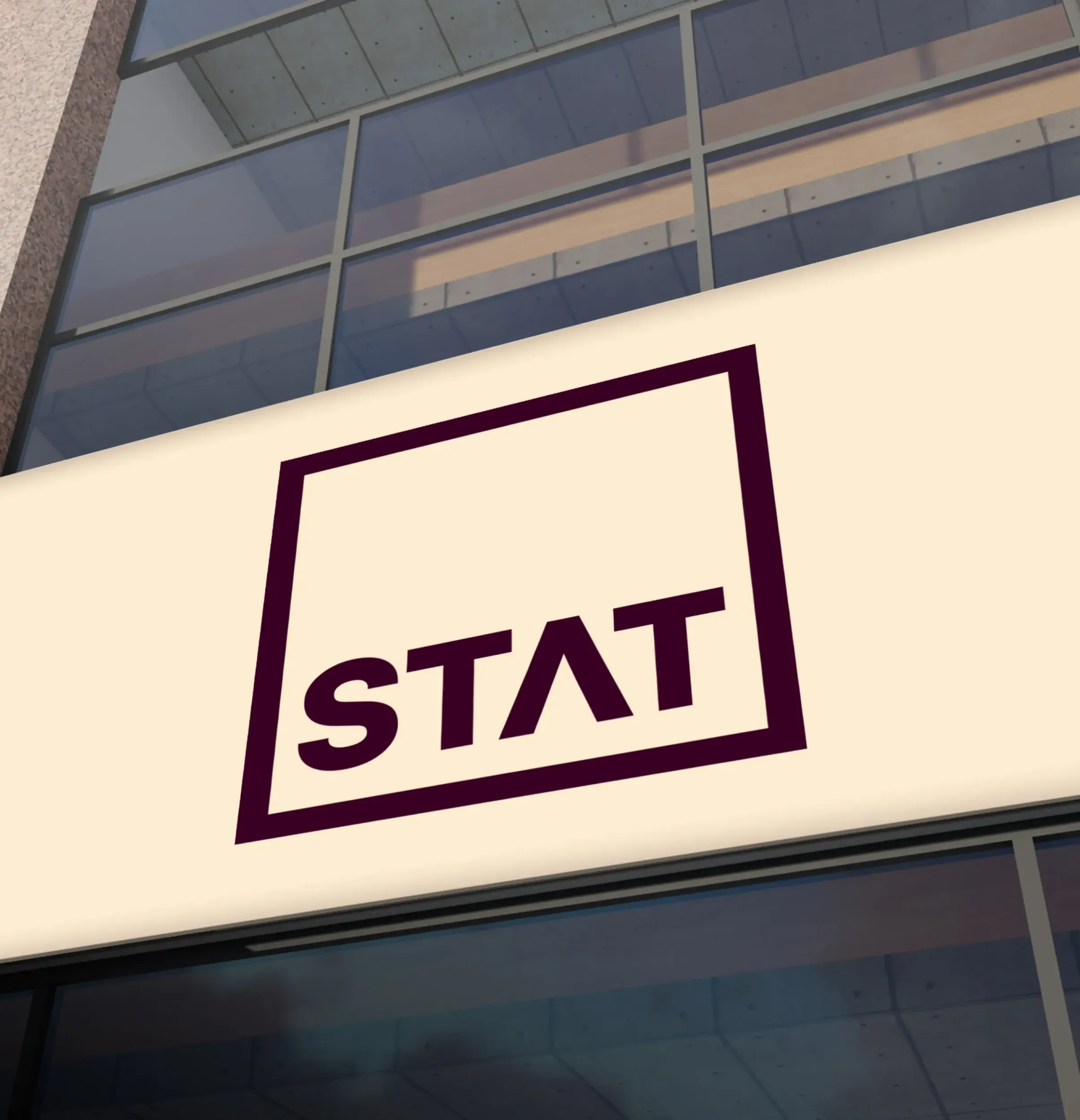 Illuminated STAT Law logo on a modern building exterior, showcasing the tangible impact of Skyne's branding agency services in Riyadh.