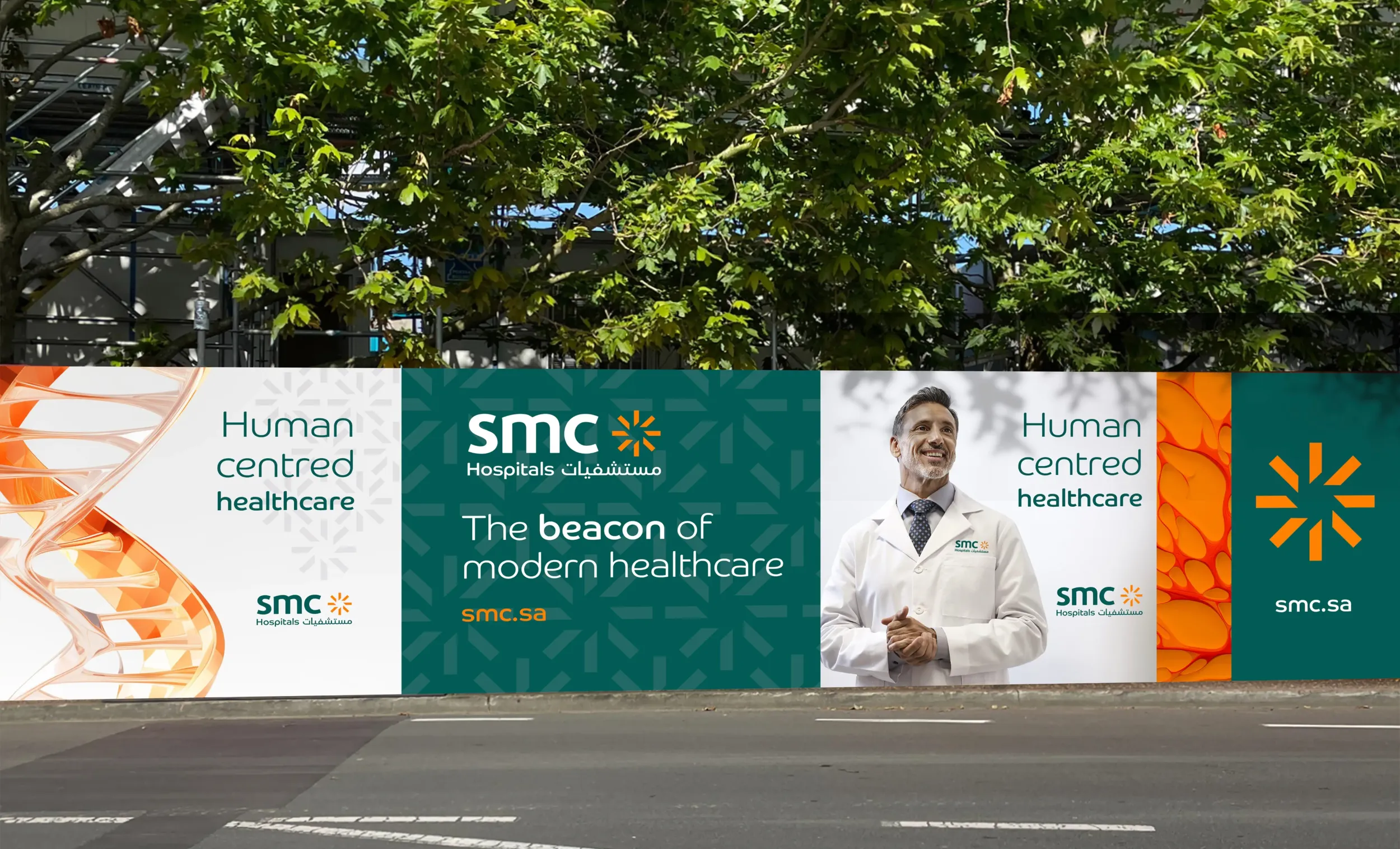 SMC Hospitals construction hoarding design with healthcare messaging, branding elements, and a smiling doctor, created by Skyne branding agency.