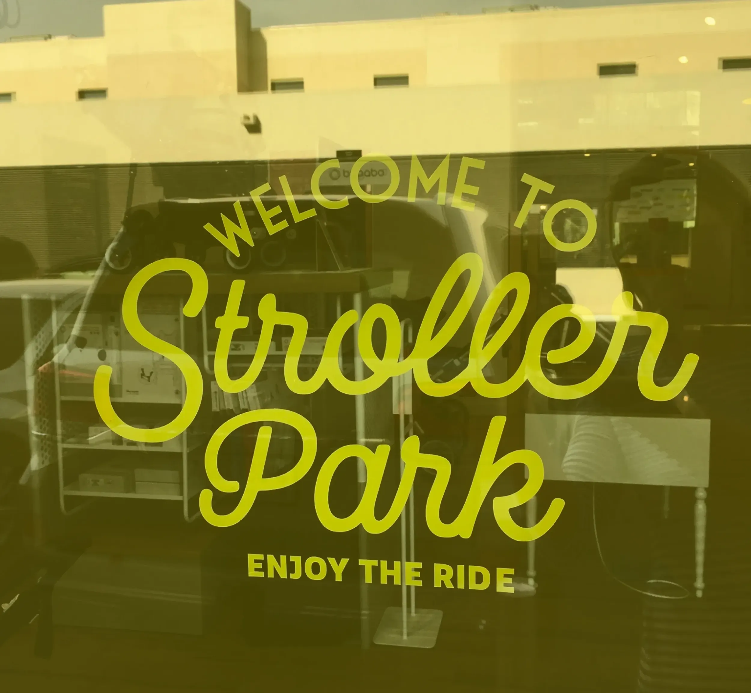 Skyne, a branding agency, designed the Stroller Park entrance, with 'Welcome to Stroller Park: Enjoy the Ride' branding on the glass, inviting customers into the immersive retail environment.