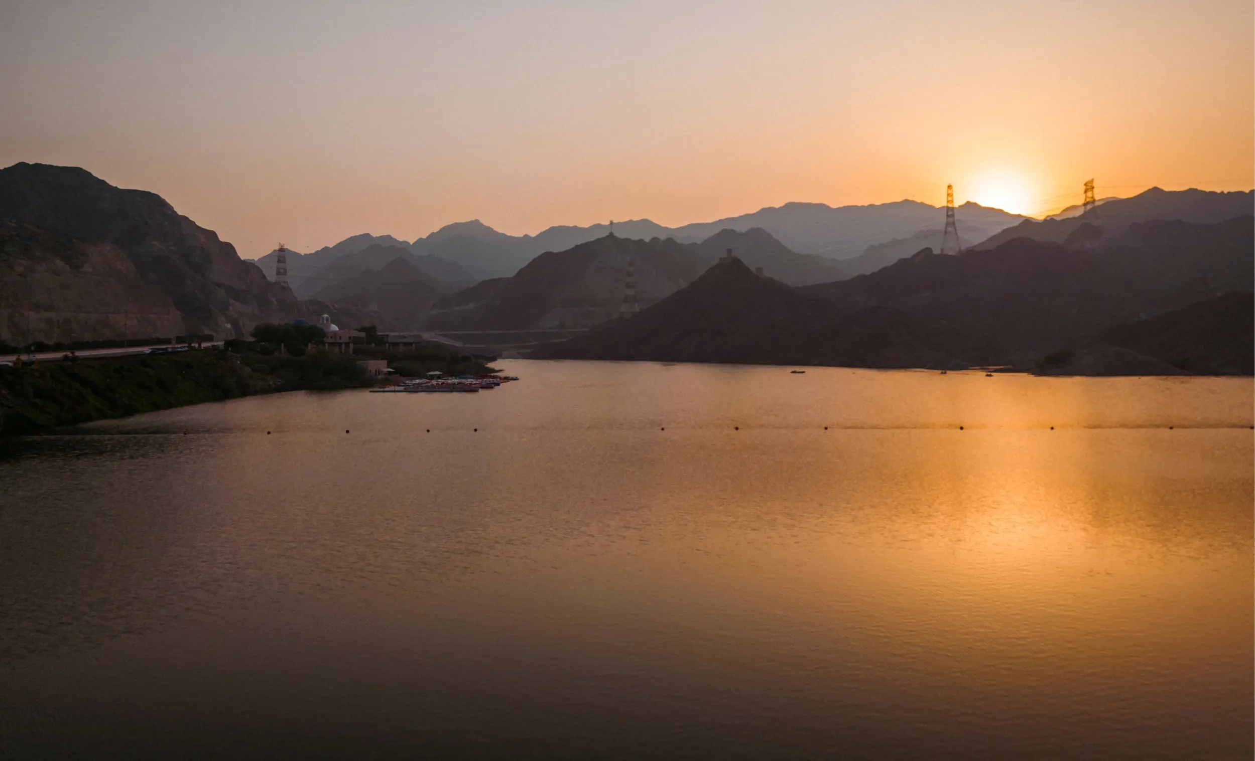 A stunning panoramic view of Al Rafisah Dam, with the new logo and branding elements overlaid. This image, created by Skyne, serves as a powerful visual for the destination's marketing and promotional materials.