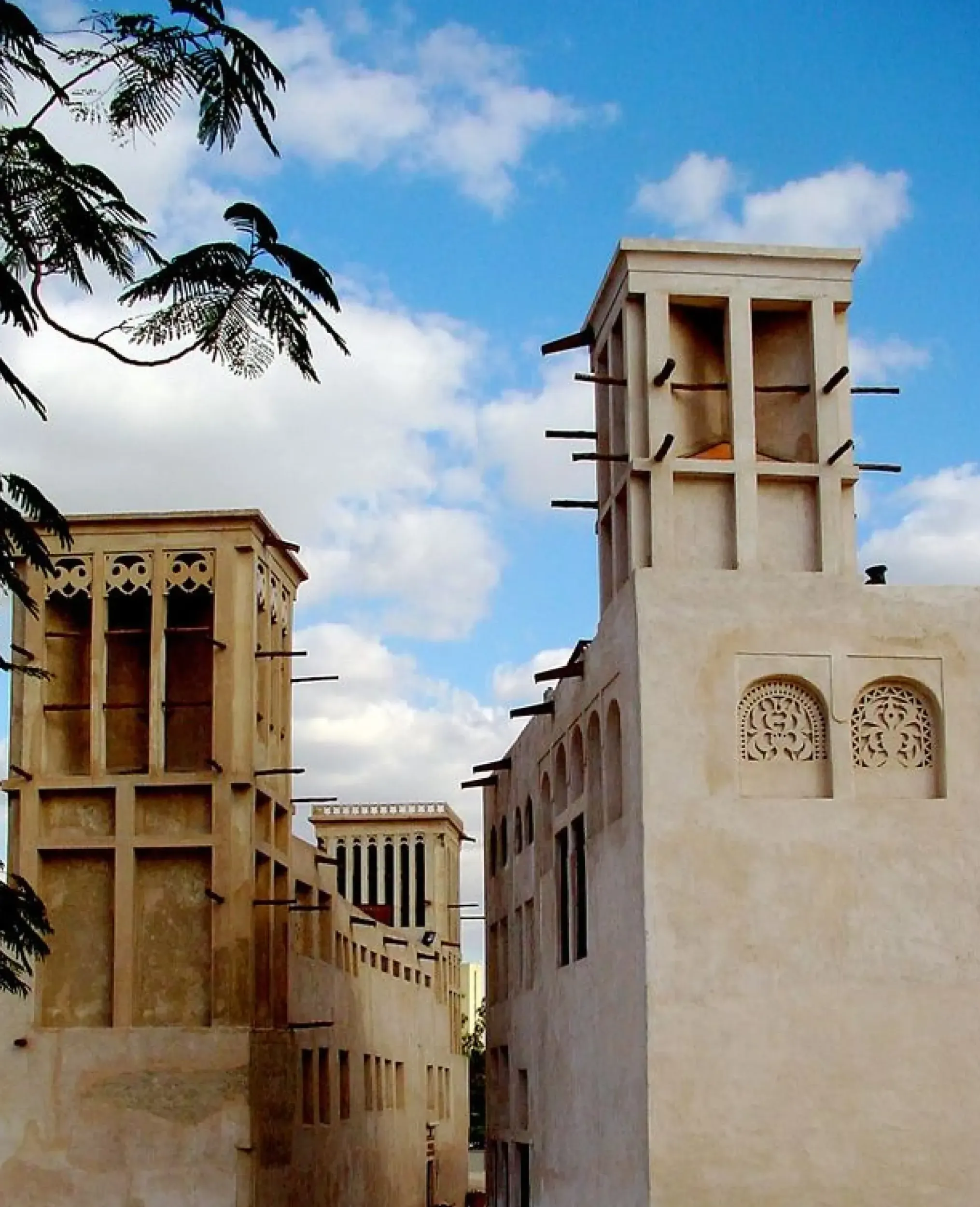 Traditional wind towers (Barajeel) in old Dubai, representing architectural details. Skyne, a branding agency, integrates cultural relevance into branding strategies for clients in Dubai, Riyadh, and Jeddah.